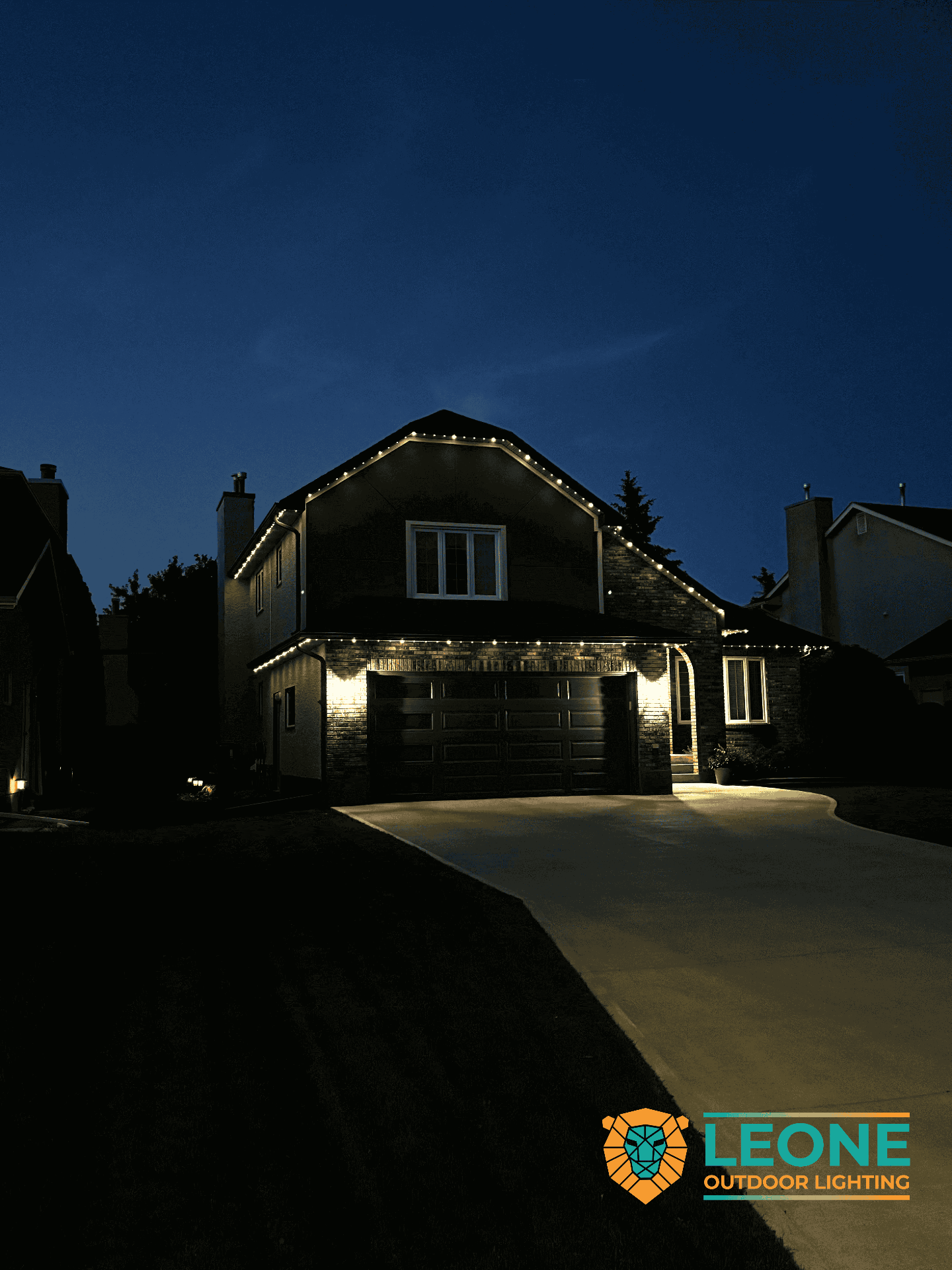 Warm white permanent LED lights outlining peaked roofline on Winnipeg family home